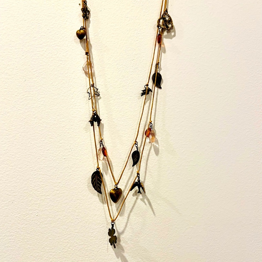 Waxed cord necklace with hand-tied charms of copper, brass & crystal.